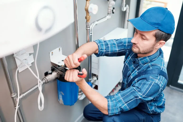 Plumber performing water system maintenance during a regular plumbing checkup to ensure efficient, reliable home water flow.
