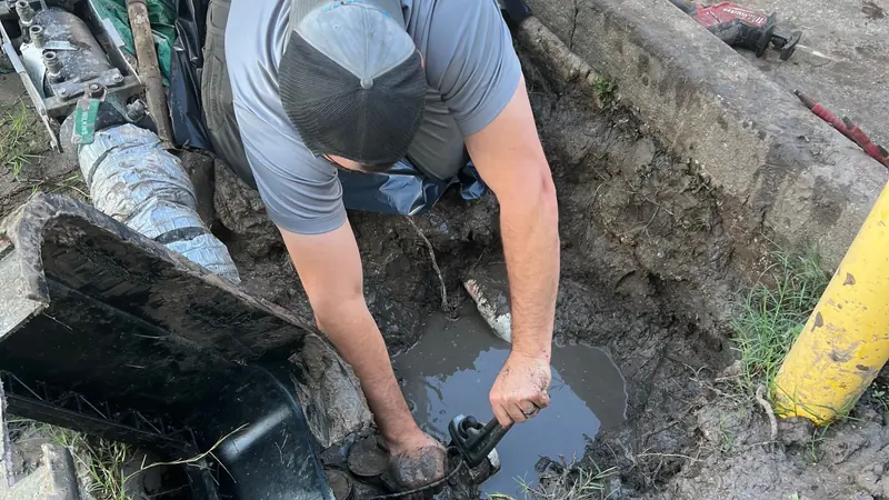 Champion technician repairing an underground plumbing line